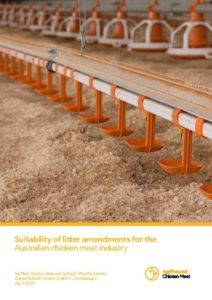 Orange poultry drinkers hang above wood shavings in a chicken shed, featured on the cover of "Suitability of litter amendments for the Australian chicken meat industry," a report highlighting R&D in poultry farming.