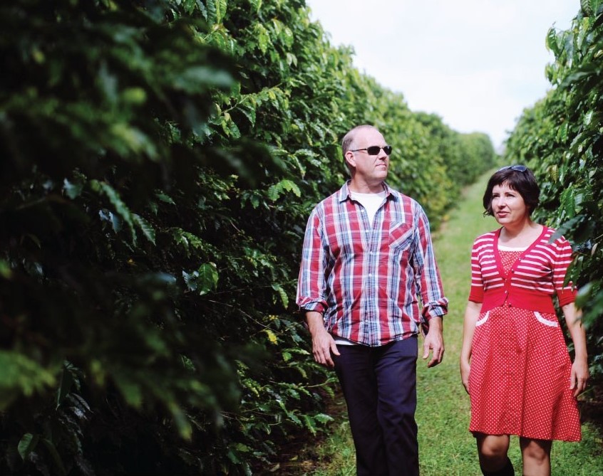 John and Rebecca Zentveld walking through their coffee plantation farm