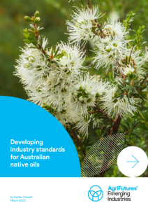 Close-up of a white-flowered Australian native plant with green leaves. Text overlay: Developing industry standards for Australian native oils, supporting Australia’s rural agriculture. AgriFutures Emerging Industries. Publication credit: Ashley Dowell.