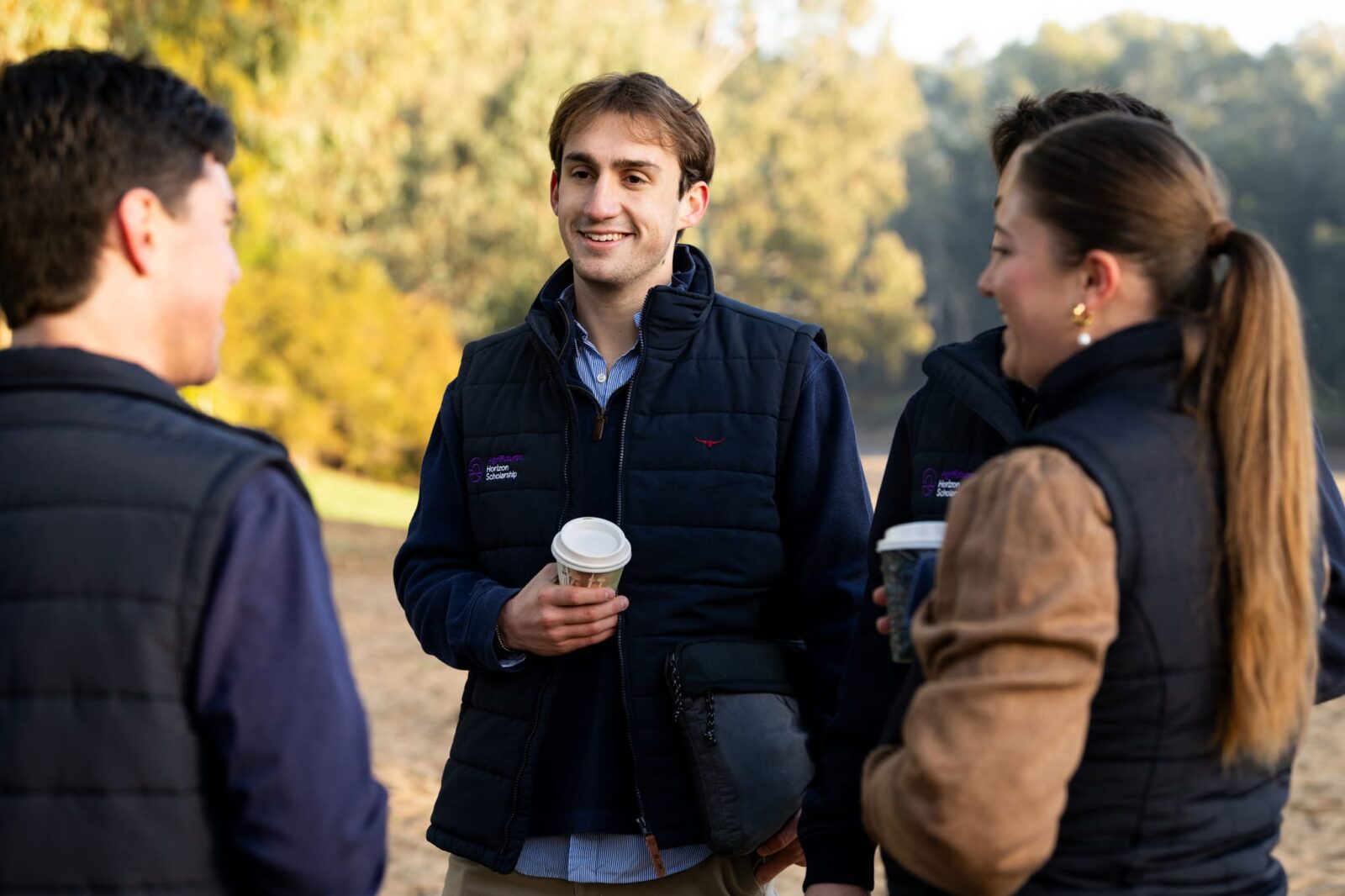 2024 horizon scholar edison west talks to other horizon scholars on wagga beach at the 2024 agrifutures stakeholder summit