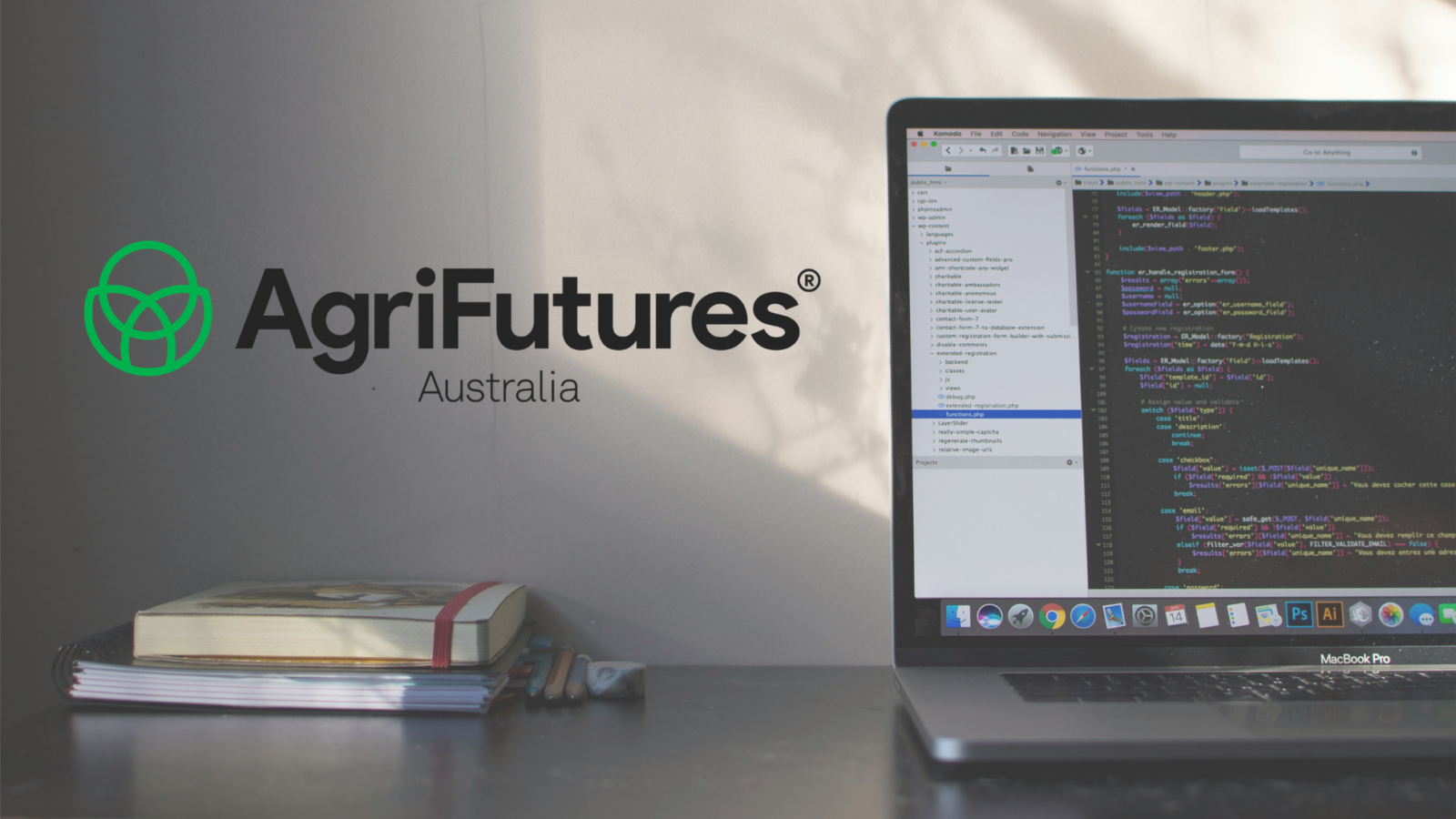 AgriFutures Australia logo next to a laptop showing website code, representing website maintenance and development.